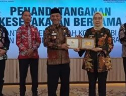 Pj Bupati Merangin Teken MoU Dengan Pemkot Jambi